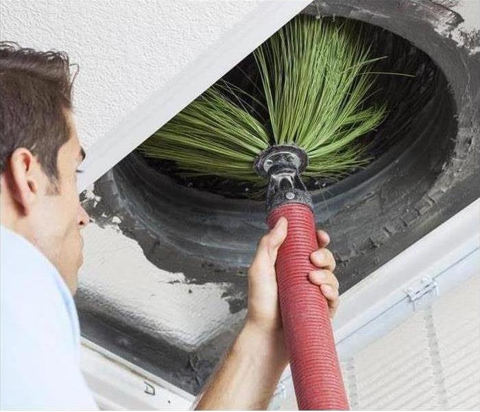 Cleaning duct with green colored cloth